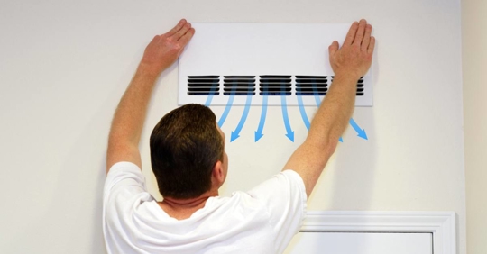 Man Checking Air Vent