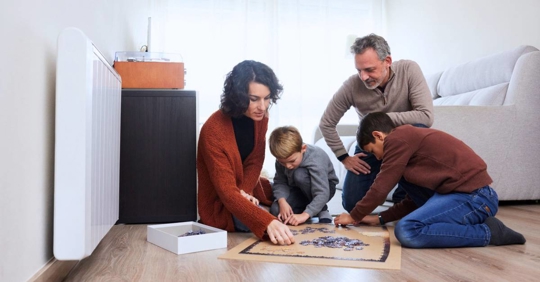 family enjoying a fun puzzle together at home
